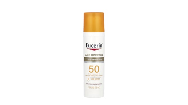 iHerb - בקבוק קרם הגנה לפנים Age Defense של Eucerin, SPF 50, עם מכסה כתום ואריזה לבנה, 75 מ"ל